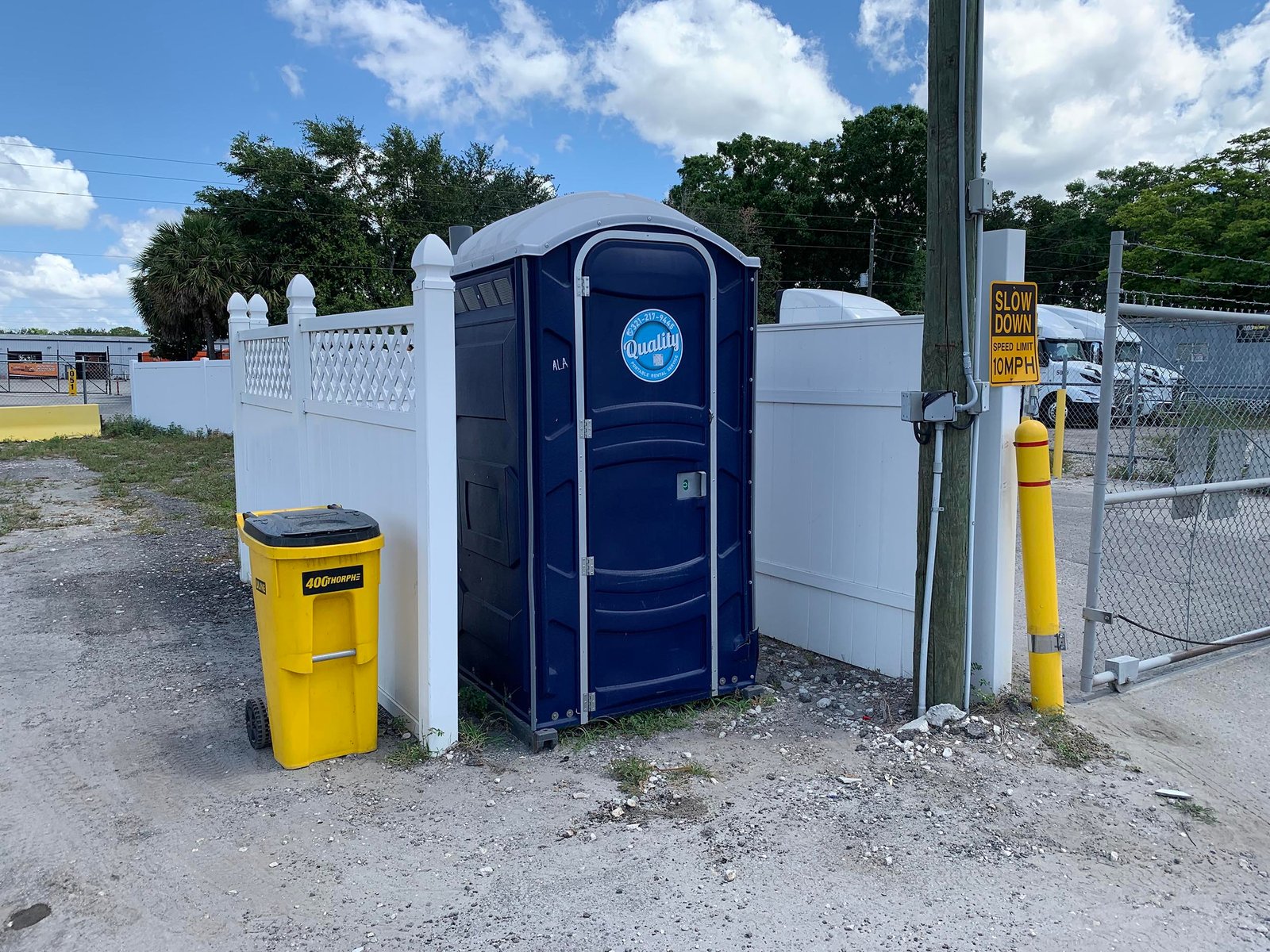 Portable toilet on side of the way